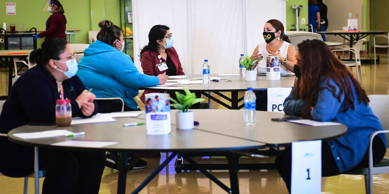 Propspective employees are interviewed during a job fair at AltaMed Health Services on July 9, 2021 in Huntington Park, Calif.