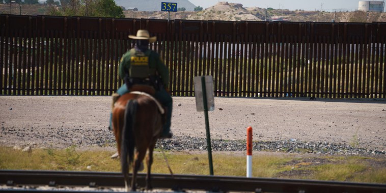 A border patrol agent patrols on horseback in Sunland Park, N.M., on Sept. 9, 2021.