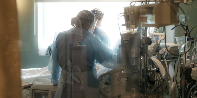 Nurses check on a patient in the ICU Covid-19 ward at NEA Baptist Memorial Hospital in Jonesboro, Ark., on Aug. 4, 2021.
