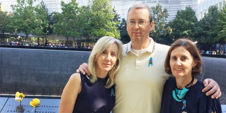 Image: Glenn Morgan with his sisters Colleen Golden, left, and Cathy Morgan at the 9/11 memorial in New York City.