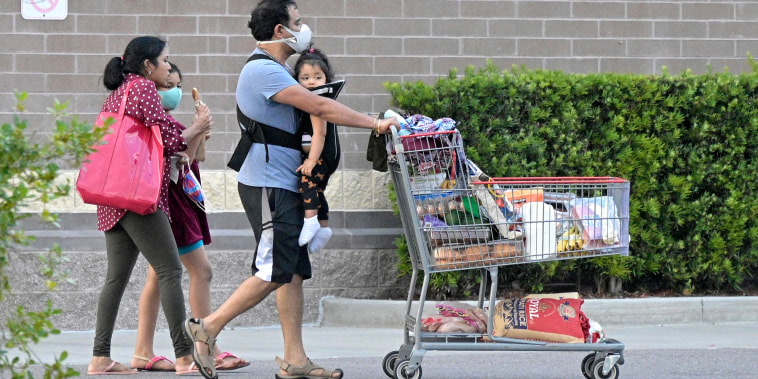 Shoppers outside a Costco Wholesale store on Sept. 5, 2021, in Orlando, Fla.