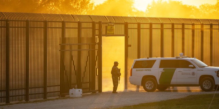 A U.S. Border Patrol vehicle drives through a gate in the border fence after U.S. Customs and Border Protection closed the point of entry with Mexico on Sept. 17, 2021, in Del Rio, Texas.