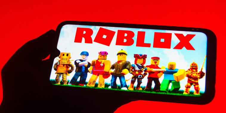 In this photo illustration the Roblox logo seen displayed on