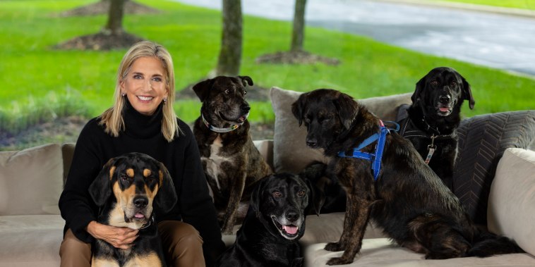 Cathy Bissell, founder of BISSELL Pet Foundation, with her adopted rescue dogs Roxy, Taz, Mo, Zoey, Hank and Lexi.