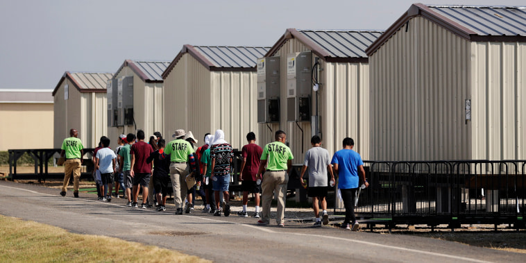 Image: Staff escort immigrants to class at the U.S. government's holding center for migrant children in Carrizo Springs, Texas, on July 9, 2019.
