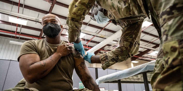 Image: Preventative Medicine Services NCOIC Sergeant First Class Demetrius Roberson administers a Covid-19 vaccine to a soldier on Sept. 9, 2021 in Fort Knox, Ky.