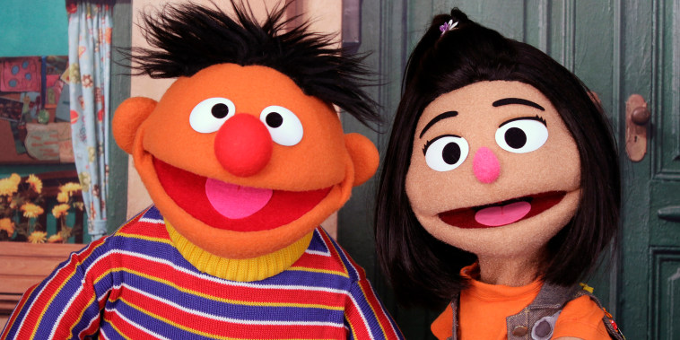 Ernie with Ji-Young, the first Asian American Muppet, on \"Sesame Street.\"