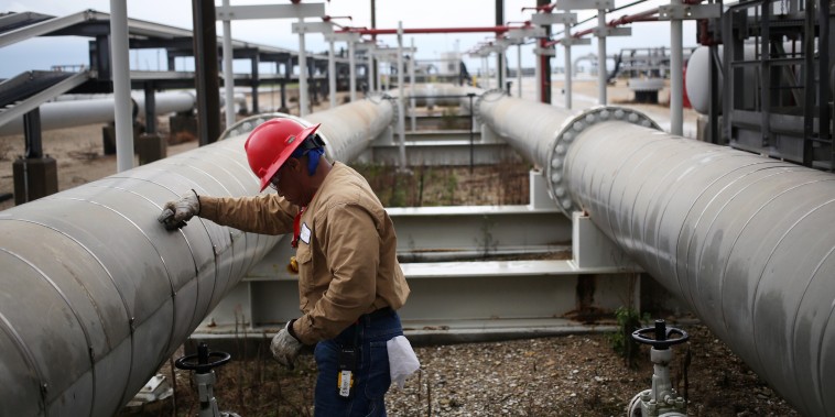 A contractor works on a crude oil pipeline at the U.S. Department of Energy's Bryan Mound Strategic Petroleum Reserve in Freeport, Texas, on June 9, 2016.