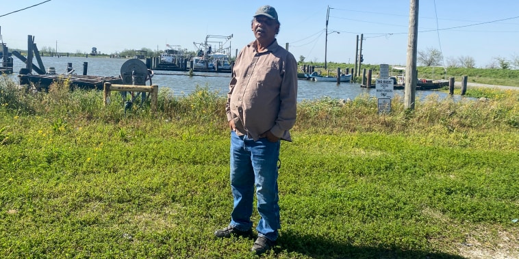 Byron Encalade, founder of the Louisiana Oystermen Association, stands at the deserted docks in Pointe ? la Hache.
