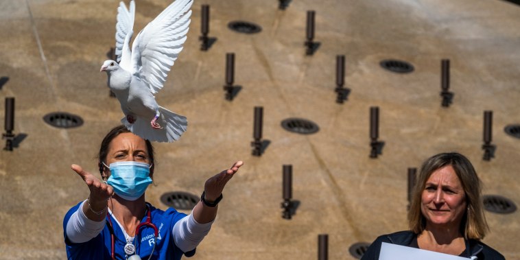 Image: More than 80 health care workers, leaders and other hospital staff will gather in front of Providence Mission Hospital's main entrance Wednesday for a moment of somber reflection and to share words of optimism in hopes for a brighter future.