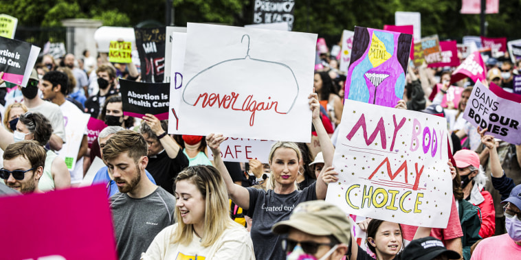 Abortion rights demonstrators and advocates march during the \"Bans Off Our Bodies\" rally from the National Mall to the Supreme Court in Washington on May 14, 2022.