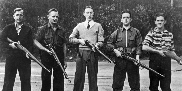 Anti-Semitic Group Posing with Rifles