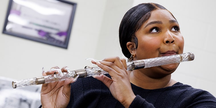 Image: Lizzo plays President James Madison's crystal flute at the Library of Congress.