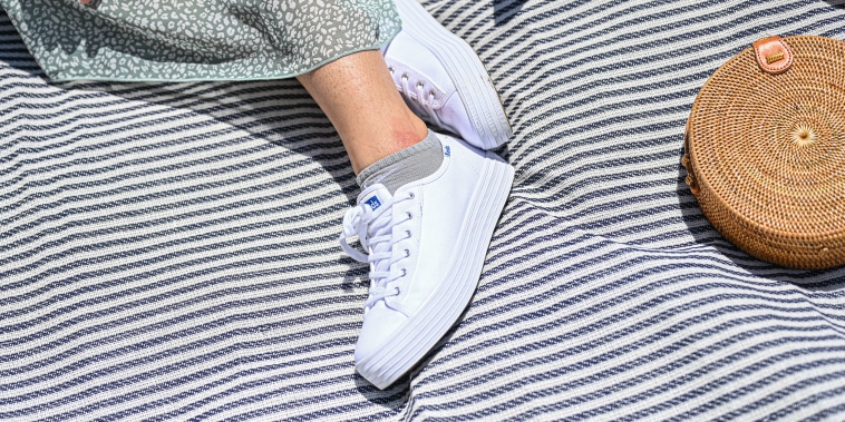 White sneakers on a blanket