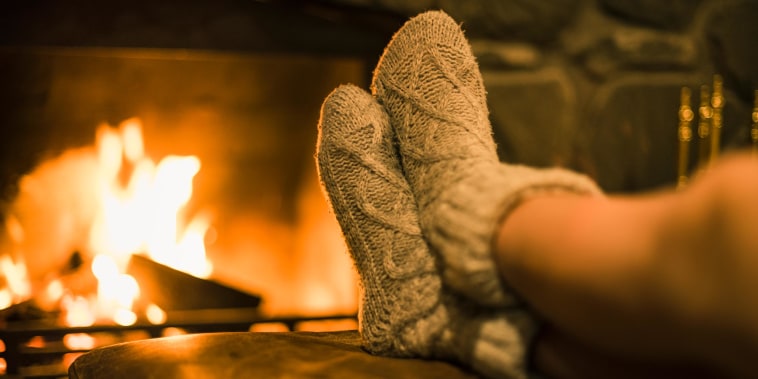 Fuzzy socks by a warm fire