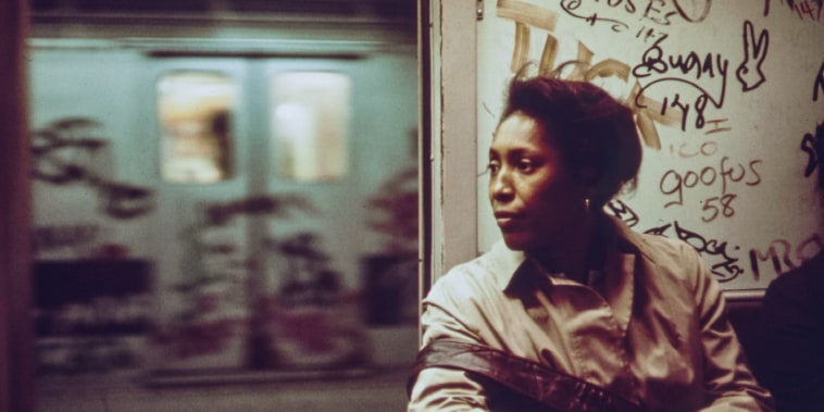 A woman sits inside a subway car in New York 1973.