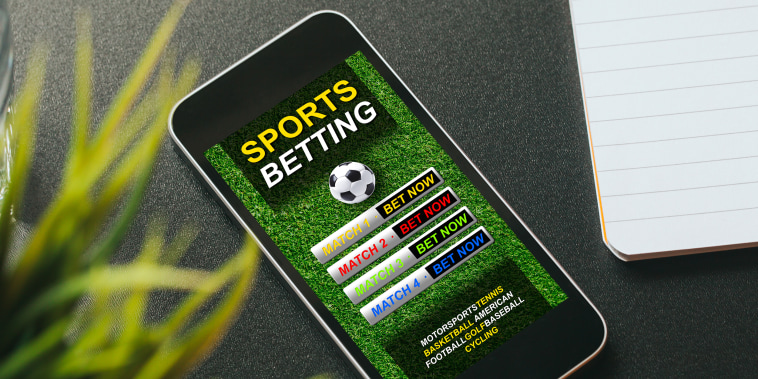 Mobile phone with sports betting website app in the screen.