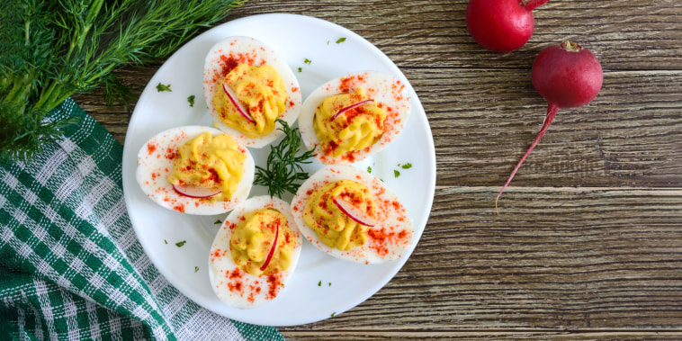 Deviled eggs. Delicious appetizer. Boiled eggs stuffed with yolk, mustard, mayonnaise, paprika. Classic recipe. The top view
