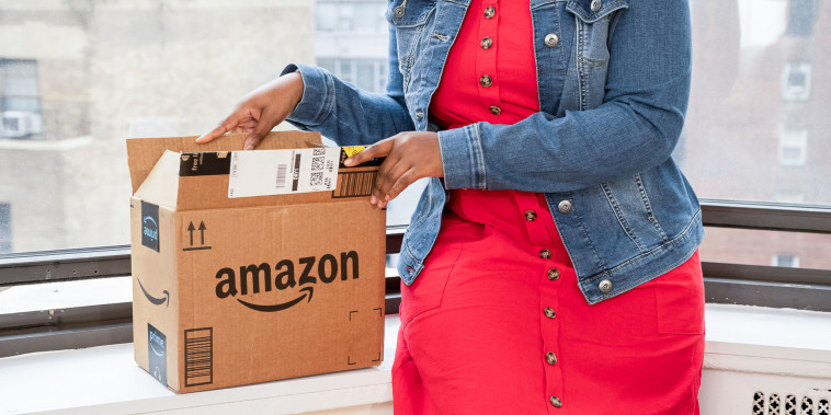 Woman opening a Amazon Box