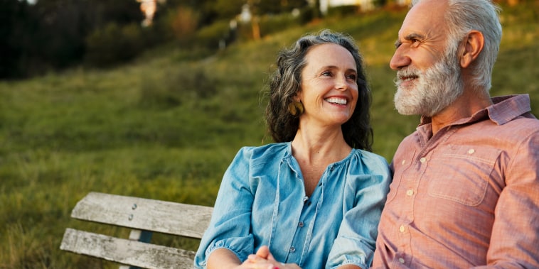 Older Man and woman on bench, smiling