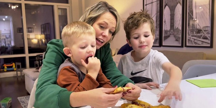 Dylan and her sons eating the pies.