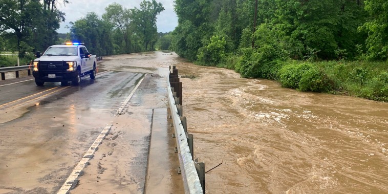 This photo provided by the Texas Department of Transportation shows a truck parked as floodwaters rise over a bridge in Grapeland, Texas on Thursday, May 2, 2024. Heavy rains have caused flooding in southeastern Texas and officials in one county asked residents to leave. (Texas Department of Transportation via AP)