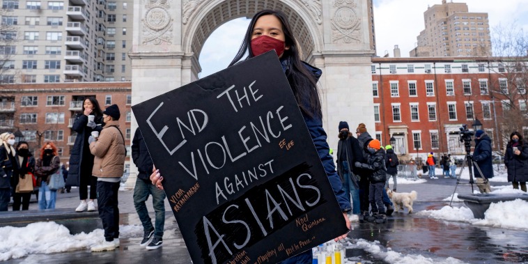 A woman holds a sign at the End The Violence Towards Asians rally in Washington Square Park on Feb. 20, 2021 in New York.