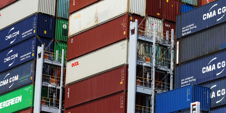 Shipping containers are stacked on the deck of a ship at the Port of Felixstowe in Felixstowe, U.K., on June 24, 2021.