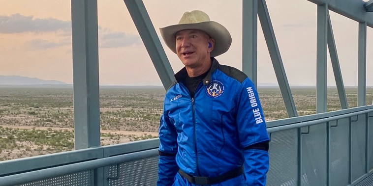 Jeff Bezos walks across the crew access gantry to enter into the crew capsule for flight on July 20, 2021.