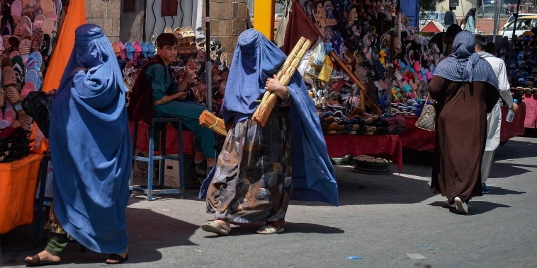 Afghan women shop at a market in Kabul on Aug. 23, 2021.