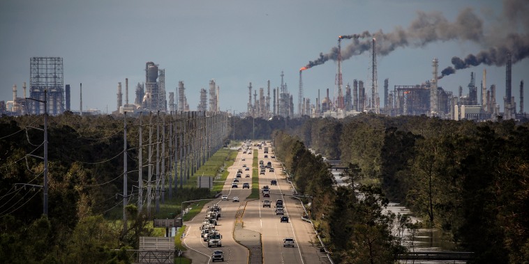 Traffic moves along a stretch of roads near the Royal Dutch Shell and Valero Energy's Norco refineries during a power outage caused by Hurricane Ida in LaPlace, La., on Aug. 30, 2021.