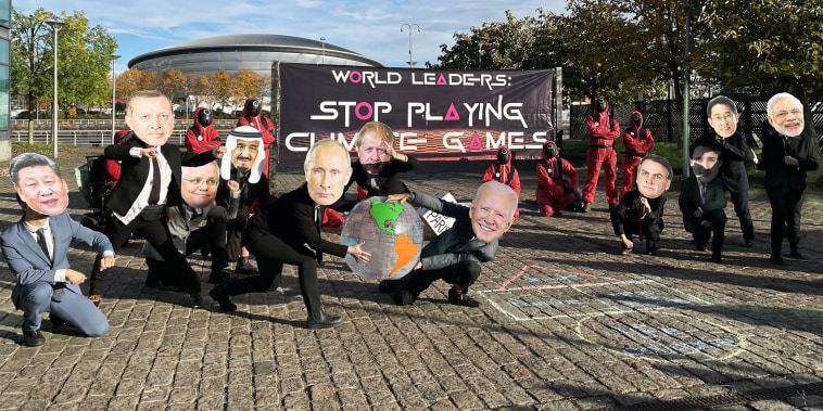 Protesters dressed as world leaders and characters from Squid Game hold a demonstration during COP26 in Glasgow, Scotland, on Nov. 2, 2021.