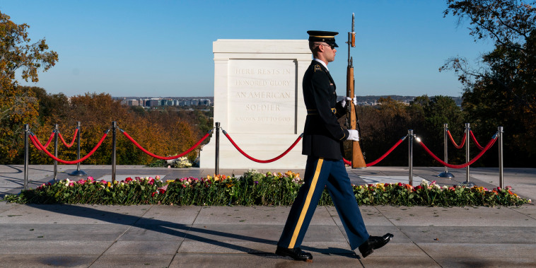 A tomb guard of the 3rd U.S. Infantry Regiment, known as "The Old Guard," walks during a centennial commemoration event at the Tomb of the Unknown Soldier in Arlington National Cemetery on Nov. 9, 2021.