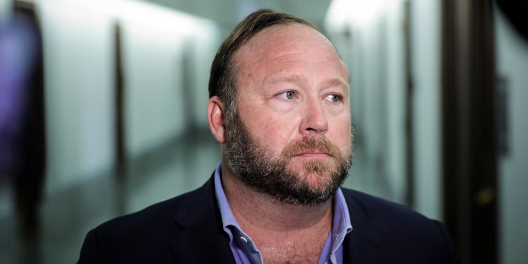 Alex Jones of InfoWars talks to reporters outside a Senate Intelligence Committee hearing on Capitol Hill on Sept. 5, 2018.