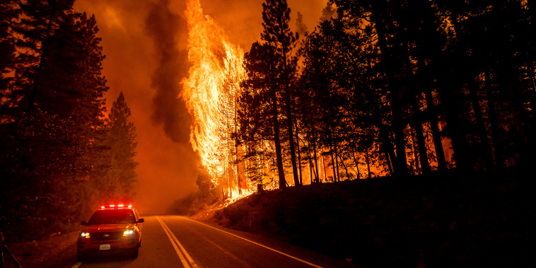 The Dixie Fire jumps Highway 89 in Plumas County, Calif. in August 2021.