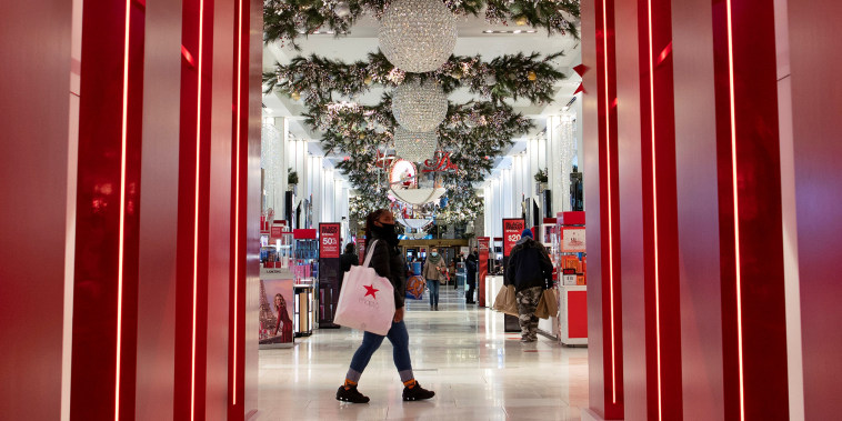 Customers shop inside Macy's Herald Square during early opening for the Black Friday sales in New York City on Nov. 27, 2020.