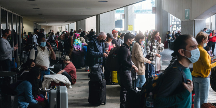 Image: Travelers at George Bush Intercontinental Airport in Houston on Nov. 20, 2021.