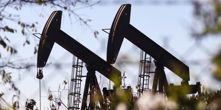 Oil pumpjacks stand in the Inglewood Oil Field on Nov. 23, 2021, in Los Angeles.
