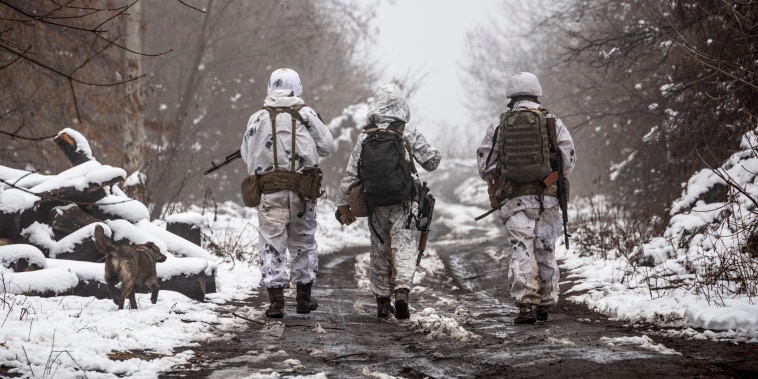 Image: Ukrainian soldiers walks at the line of separation from pro-Russian rebels near Katerinivka, Donetsk region, Ukraine, on Dec 7, 2021.