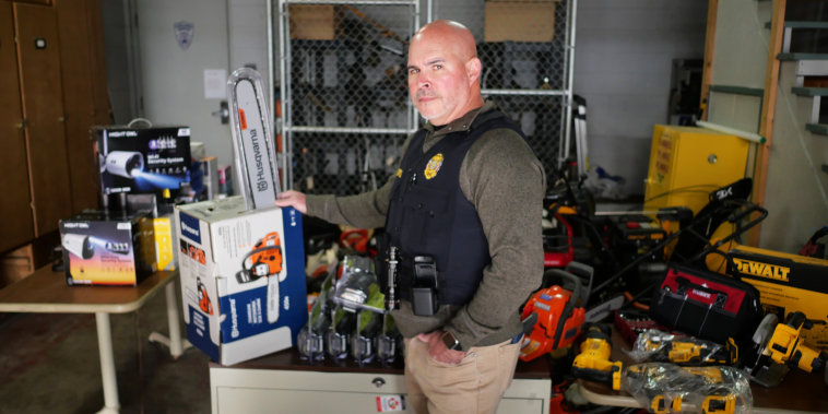 Det. Sgt. Todd Curtis of the Perrysburg Township Police Department holds a stolen Husqvarna chainsaw that he bought from Richard Nye off of Facebook Marketplace in an undercover buy.