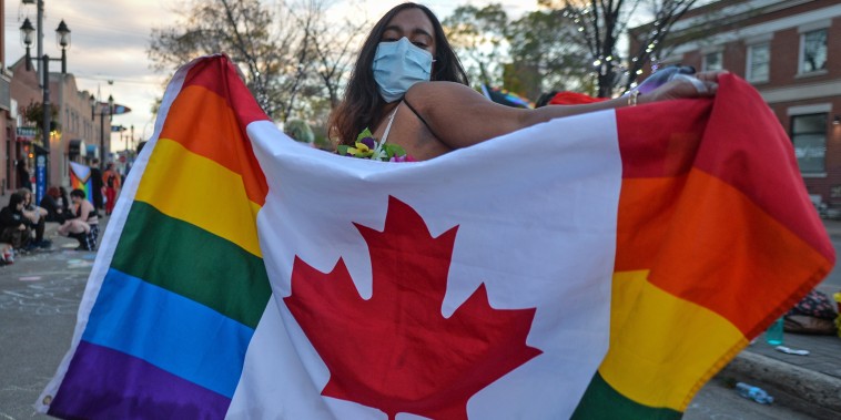 Supporters of LGBTQ rights gather at Pride Corner in Edmonton, Canada, on Sept. 24, 2021, to counter protesting street preachers.