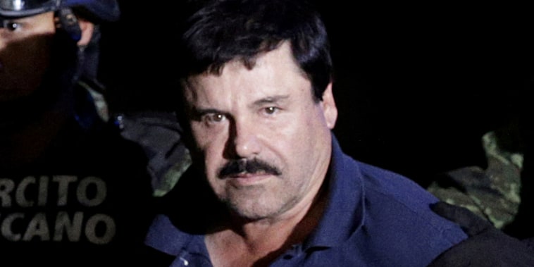 FILE PHOTO: FILE PHOTO: Recaptured drug lord Joaquin "El Chapo" Guzman is escorted by soldiers at the hangar belonging to the office of the Attorney General in Mexico City