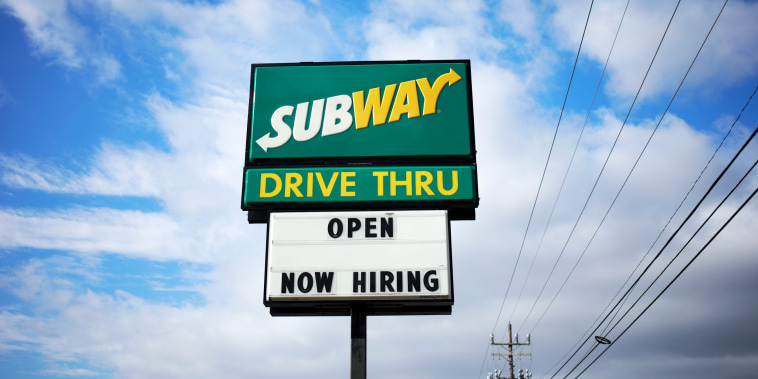 A 'Now Hiring' sign outside a Subway restaurant in Seymour, Ind., on Dec. 6, 2021.