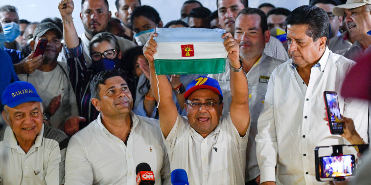 Opposition candidate Sergio Garrido celebrates after ruling party candidate Jorge Arreaza admitted on social media his defeat in a governor election re-run in Barinas, Venezuela, Sunday.