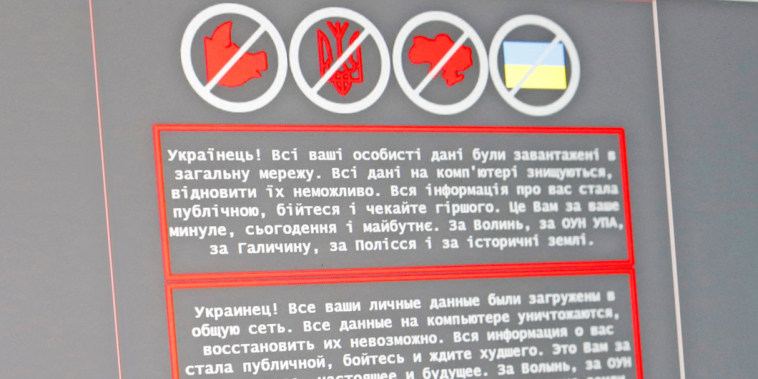 Image: A laptop screen displays a warning message on the official website of the Ukrainian Foreign Ministry, in this illustration
