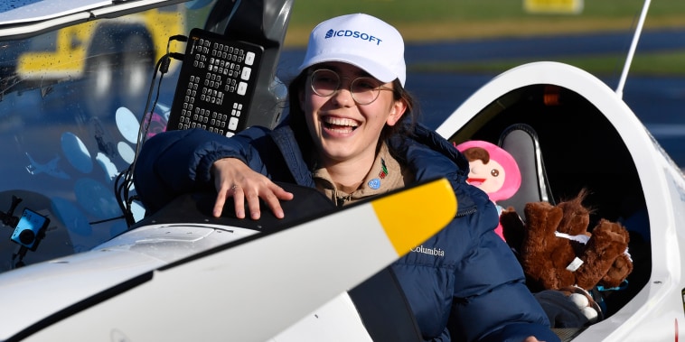 Belgium-British teenage pilot Zara Rutherford smiles as she gets out of the cockpit after landing her Shark ultralight plane at the Kortrijk airport in Kortrijk, Belgium, Thursday, Jan. 20, 2022.