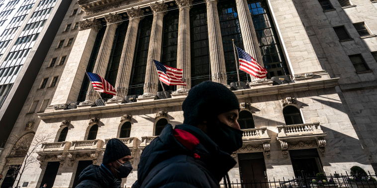 Image: A pedestrian passes the New York Stock Exchange on Jan. 24, 2022, in New York.