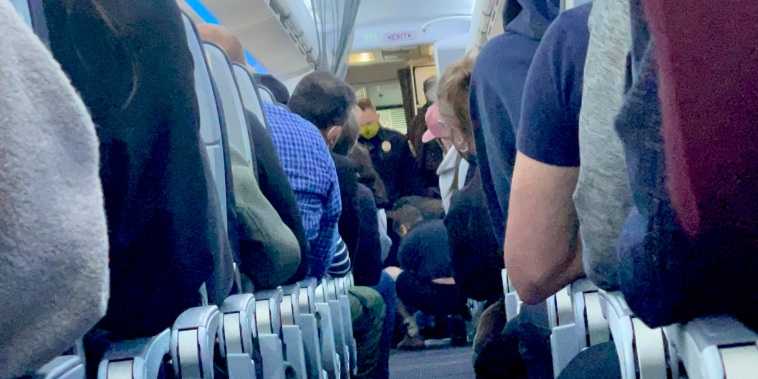 Washington-bound American Airlines flight had to divert to Kansas City after crew members and passenger subdued an “unruly passenger” on Feb. 13, 2022.