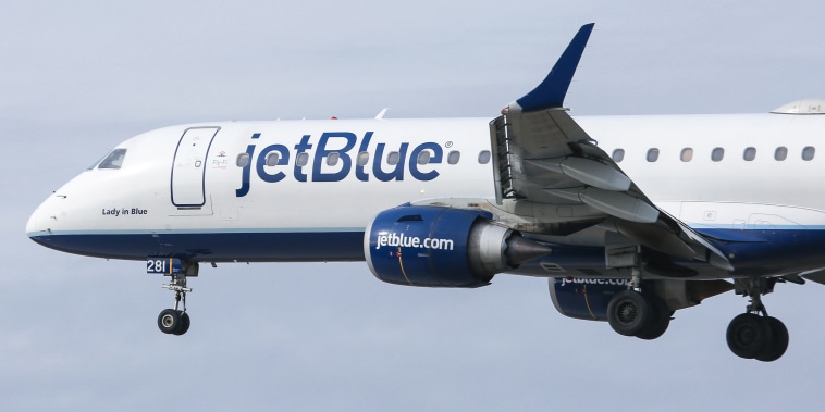 A JetBlue Airways plane on final approach landing at JFK International Airport on Jan. 23, 2020.