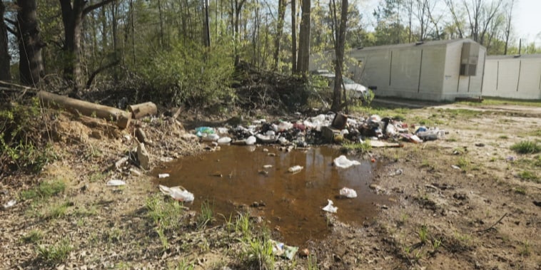 Raw sewage and debris pool into backyards in Hayneville, Alabama.
